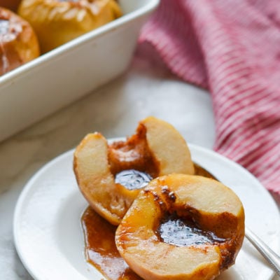 Baked apples on a small plate.