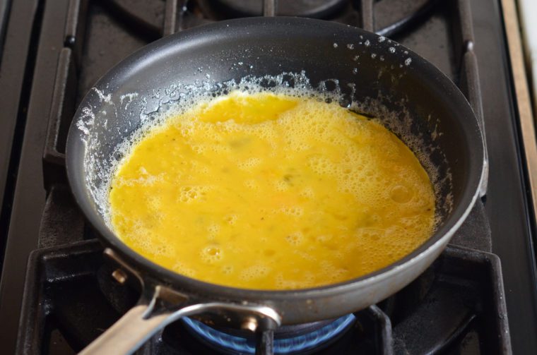 how to make an omelette - letting the eggs set around the edges