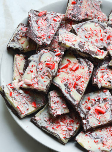 Pile of marbled peppermint bark on a plate.
