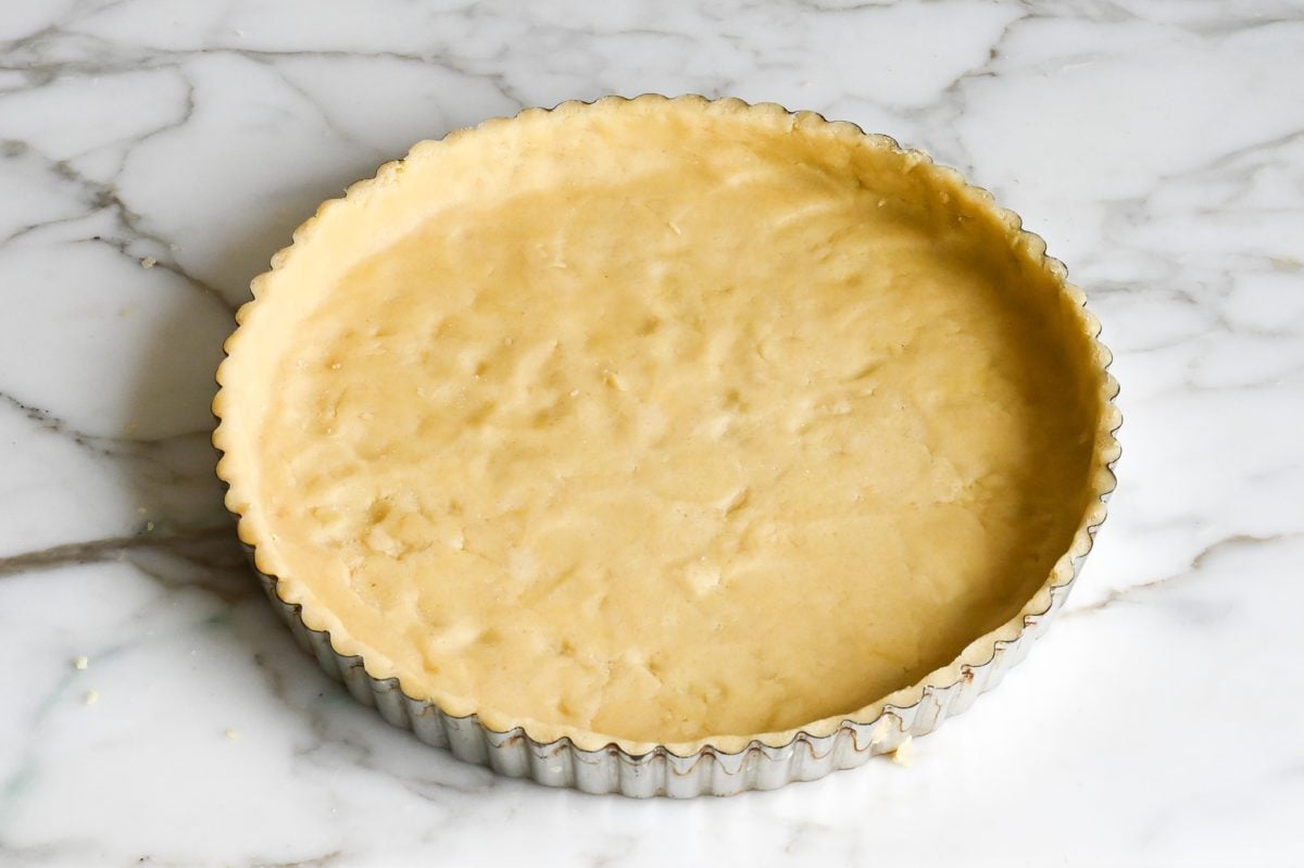 Tart dough pressed into pan.