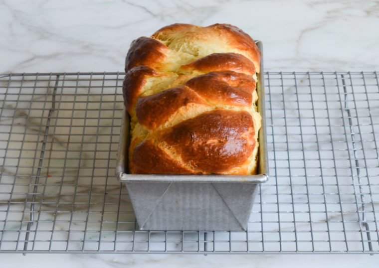 Cooked brioche in a bread pan.