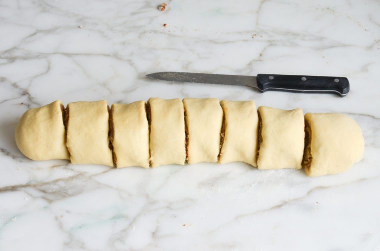 dough log cut into rolls