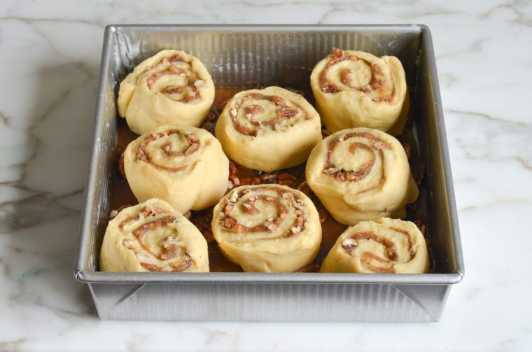 raw sticky buns in cake pan