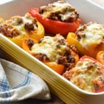 Stuffed peppers in a baking dish.