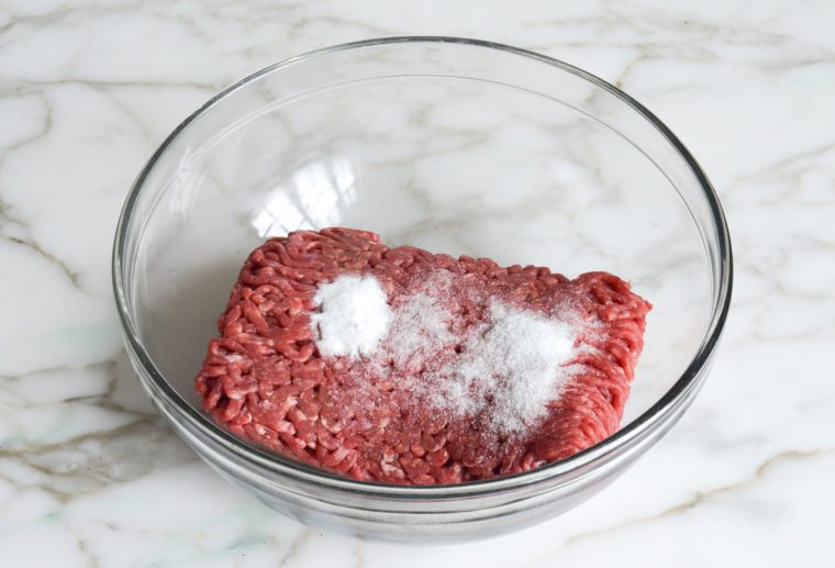 beef, baking soda, and salt in bowl