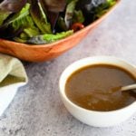 Spoon in a bowl of balsamic vinaigrette.