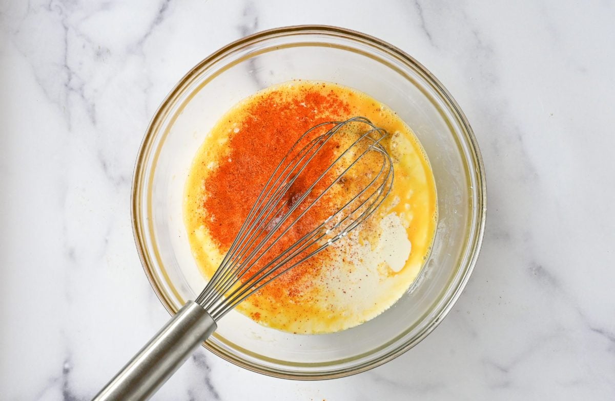 eggs, cream and seasoning in bowl