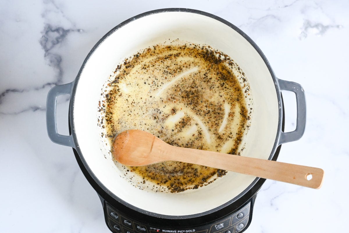 stirring butter and pepper