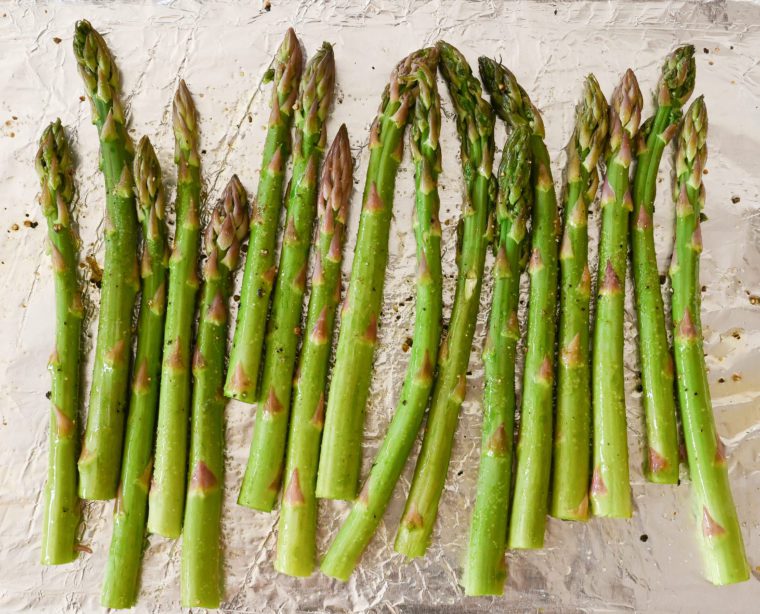 asparagus tossed with oil and seasoning