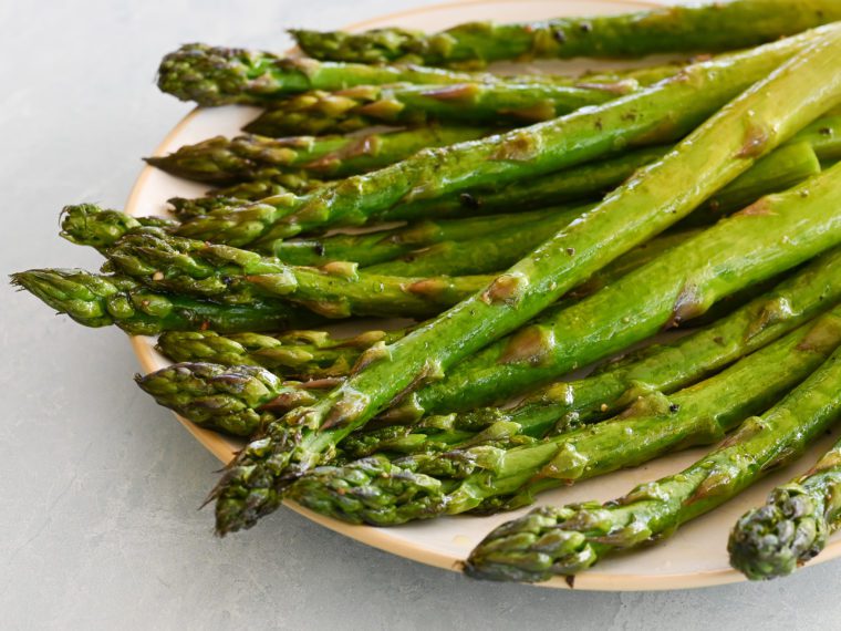 Roasted asparagus on a plate.