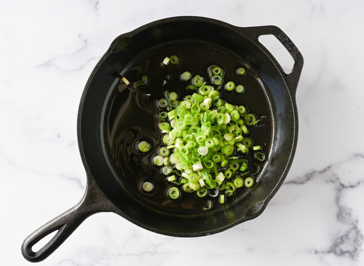 adding scallions to oil
