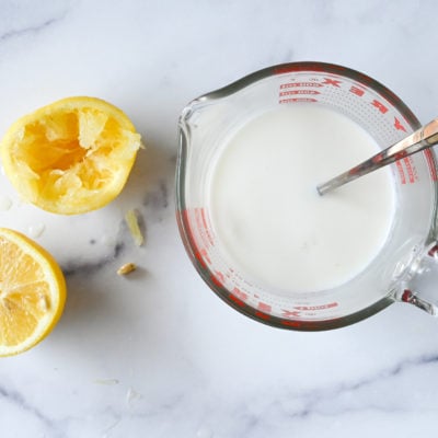milk and lemon juice in measuring cup