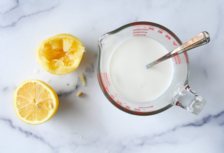 milk and lemon juice in measuring cup