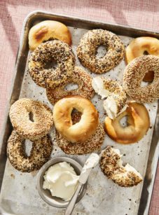 Lined baking sheet of Montreal bagels.
