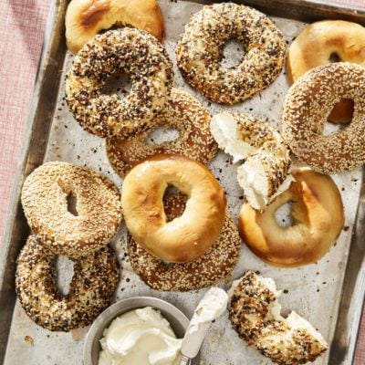 Lined baking sheet of Montreal bagels.