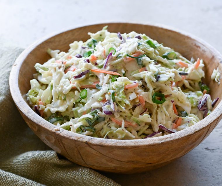 Classic coleslaw in a wooden bowl.