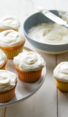 Cream cheese frosting and vanilla cupcakes.