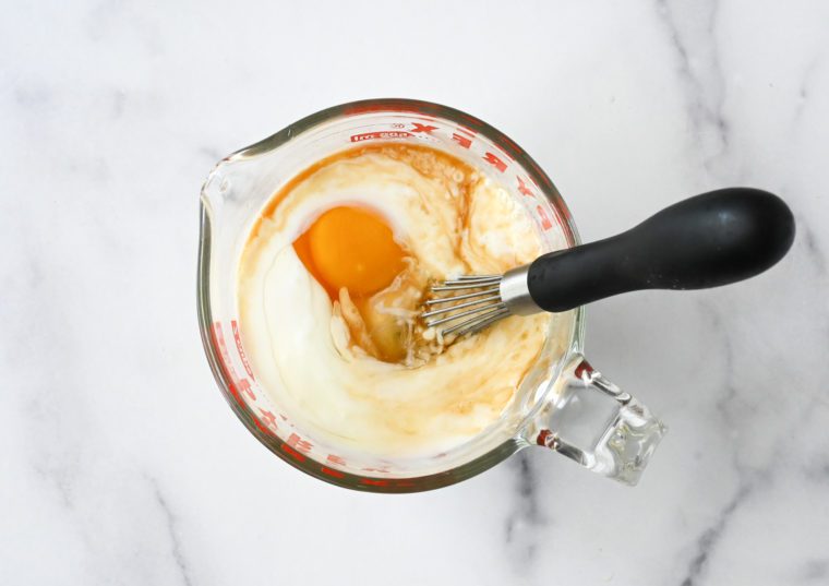 eggs, buttermilk and vanilla in measuring cup
