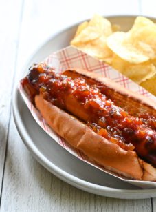 Hot dog topped with spicy relish.