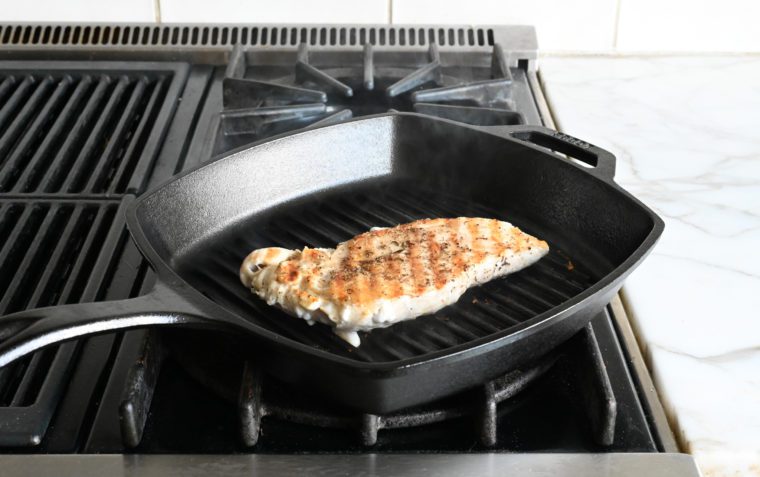 Chicken cooking in a grill pan.