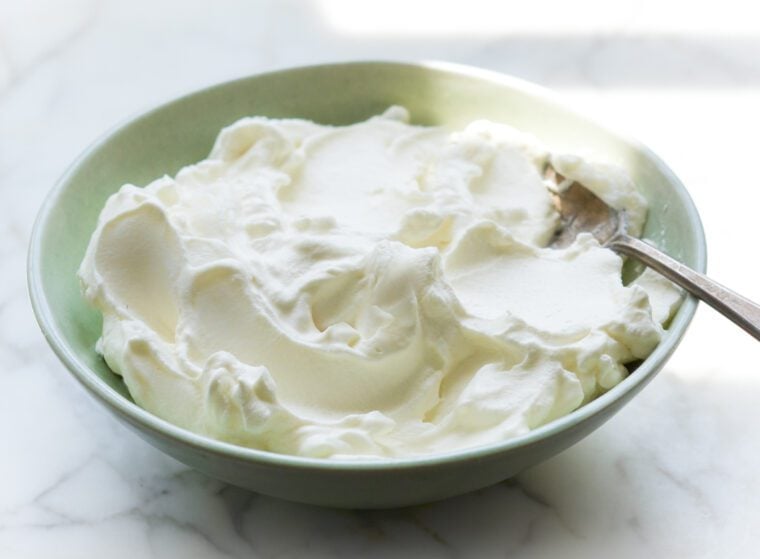 bowl of whipped cream with spoon
