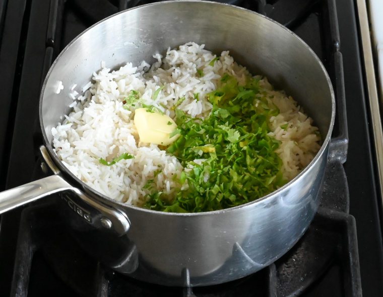 adding butter, cilantro, and lime to rice