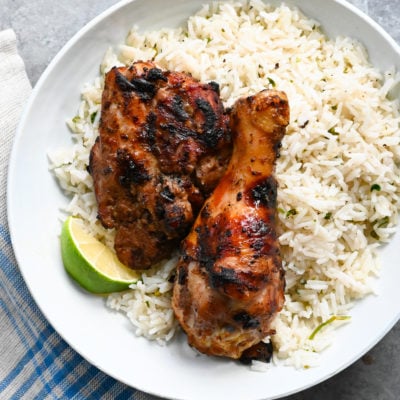 Plate of Jamaican jerk chicken over rice.