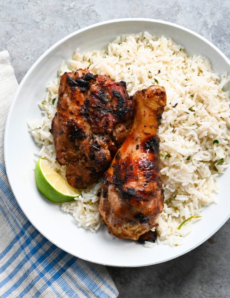 Plate of Jamaican jerk chicken over rice.