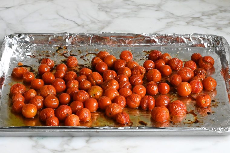 roasted cherry tomatoes on baking sheet