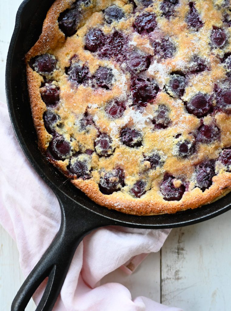 Cherry clafoutis in a skillet.