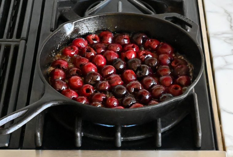 Cherries in a brown sugar and butter mixture.