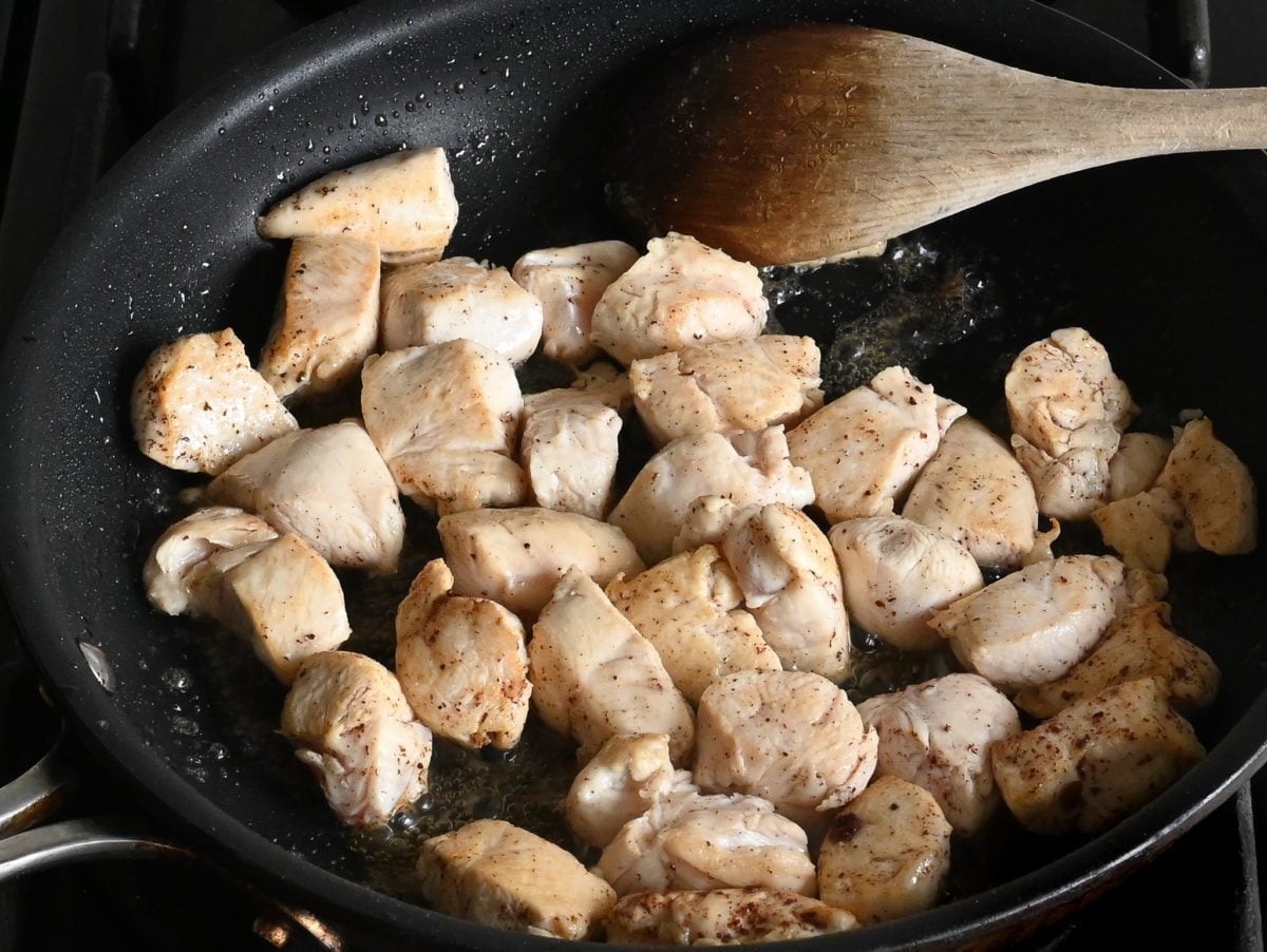 cooked chicken pieces in skillet