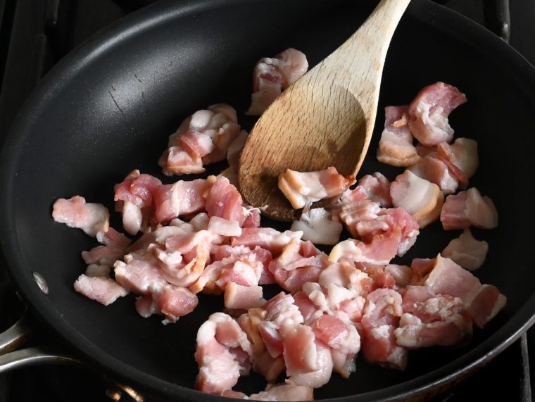 raw bacon in nonstick skillet