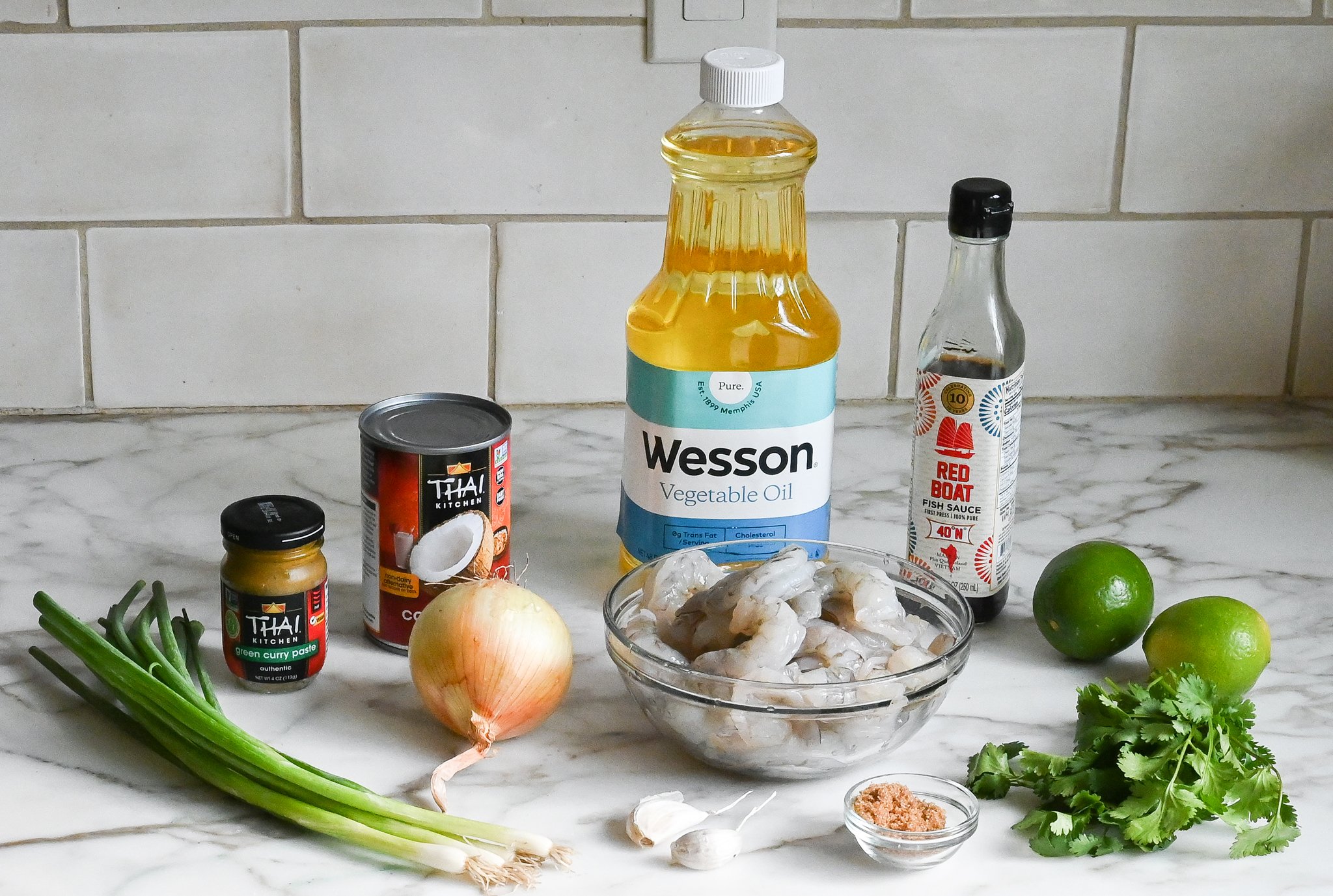 Thai shrimp curry ingredients on a counter before cooking.