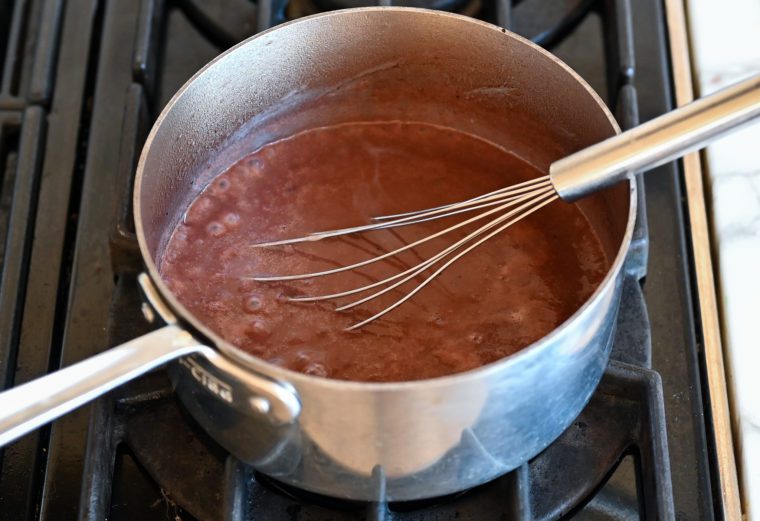 simmering red wine sauce