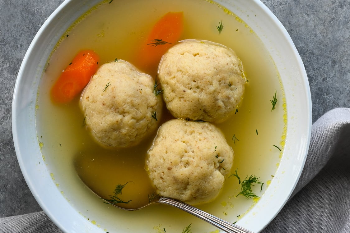 Bowl of matzo ball soup.