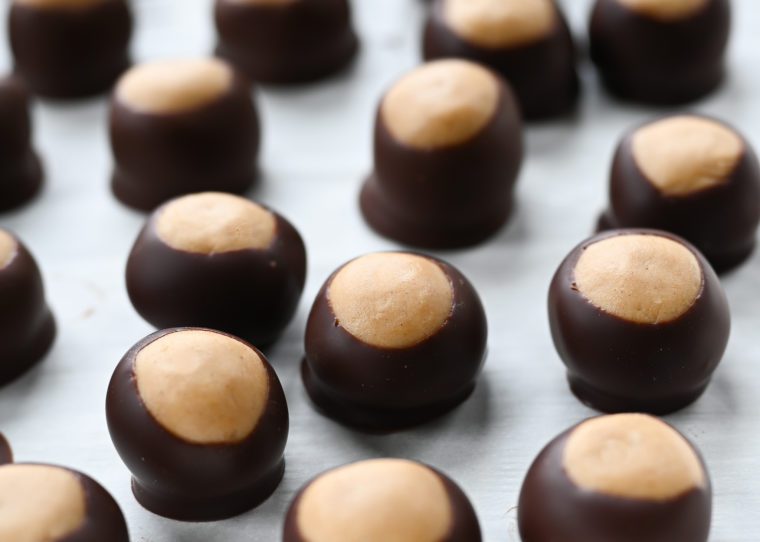 Chilled buckeyes on parchment paper.