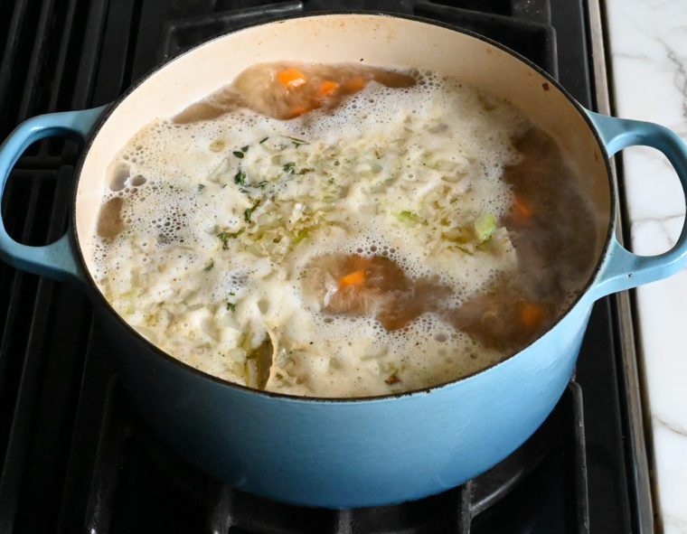 bringing the soup to a boil