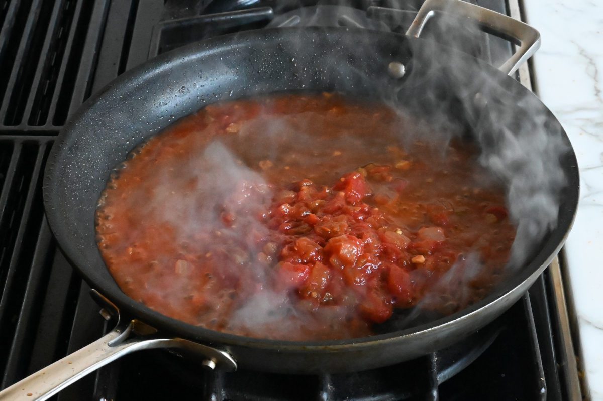 salsa and water bubbling in the skillet