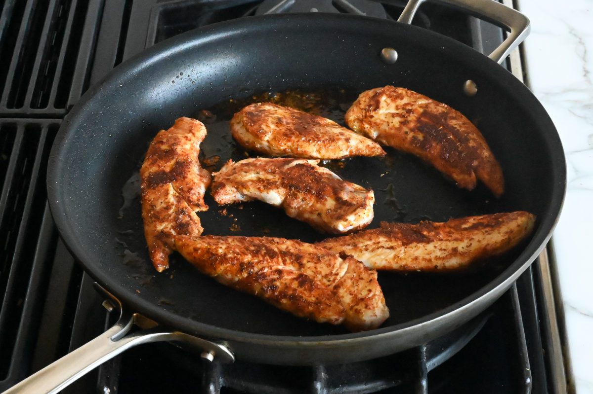 cooking chicken on second side in skillet