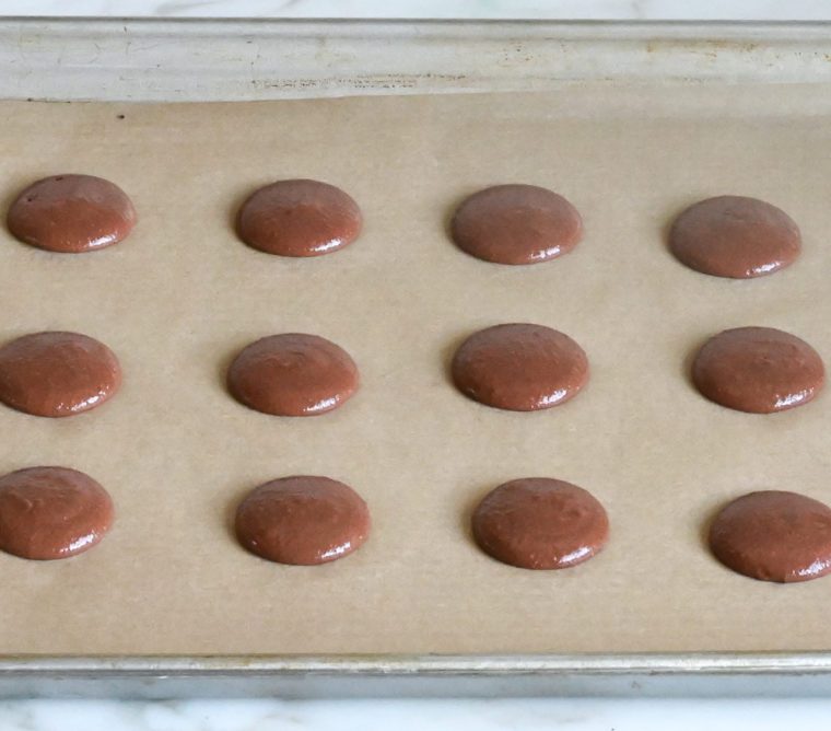 chocolate macarons ready to bake