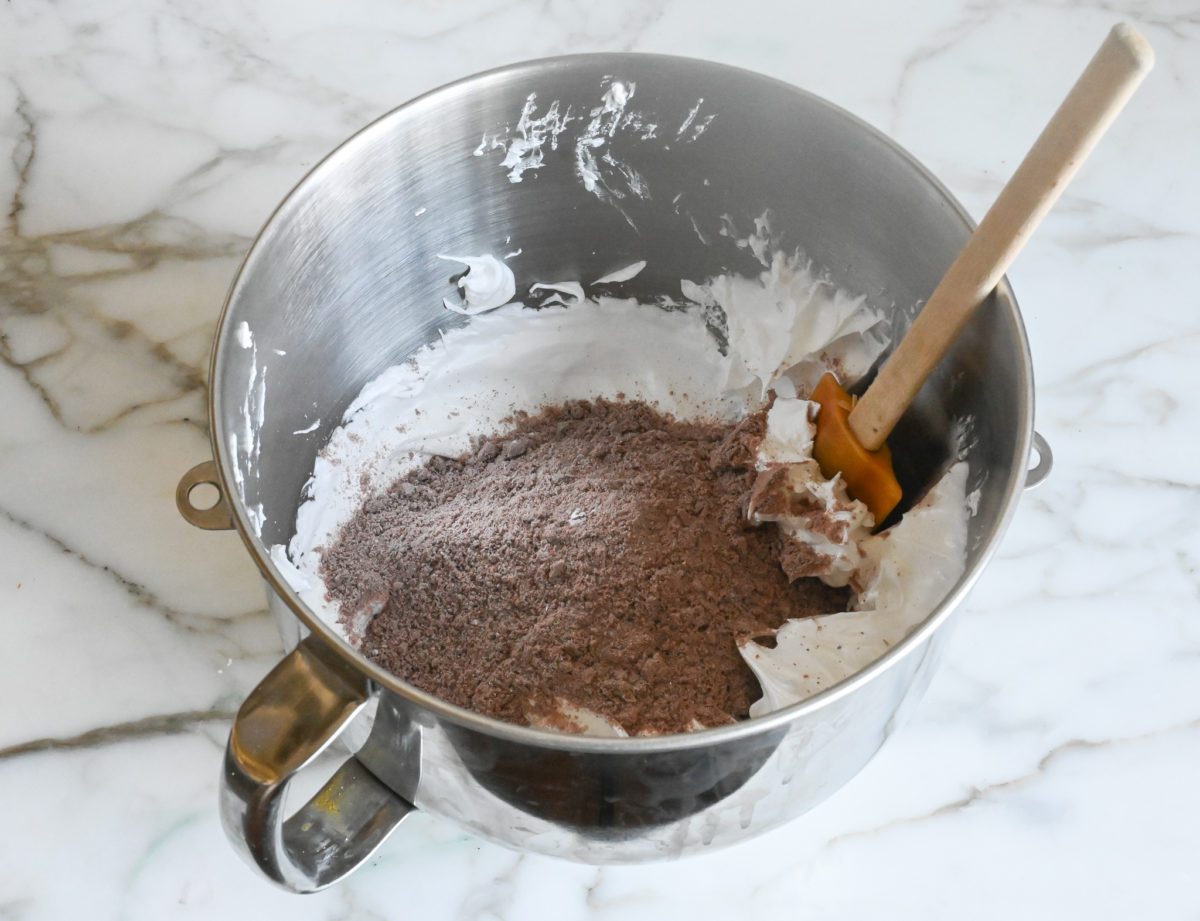 meringue and dry ingredients in mixing bowl