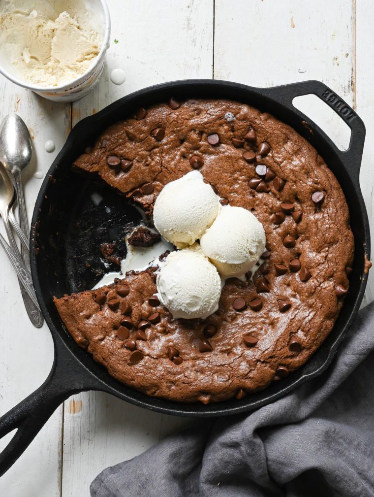 Double chocolate skillet cookie missing a slice.