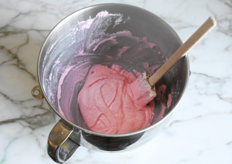 macaron batter with figure 8 ribbon in the bowl