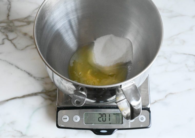 weighing eggs and sugar
