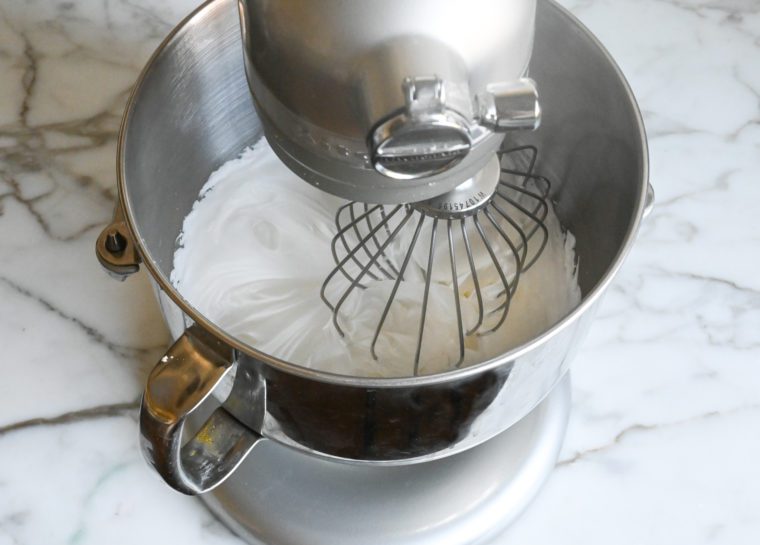 whipping the egg white and sugar mixture in heavy-duty mixer
