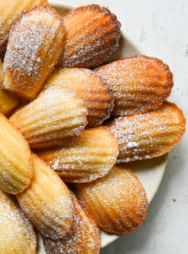 Madeleines on a plate.