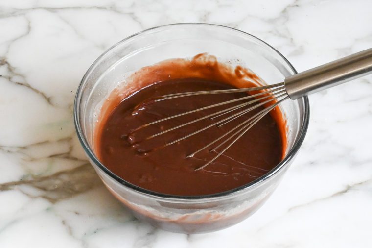 Whisk in a bowl of chocolate filling.