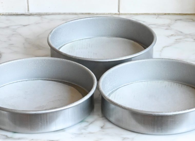 prepping the cake pans
