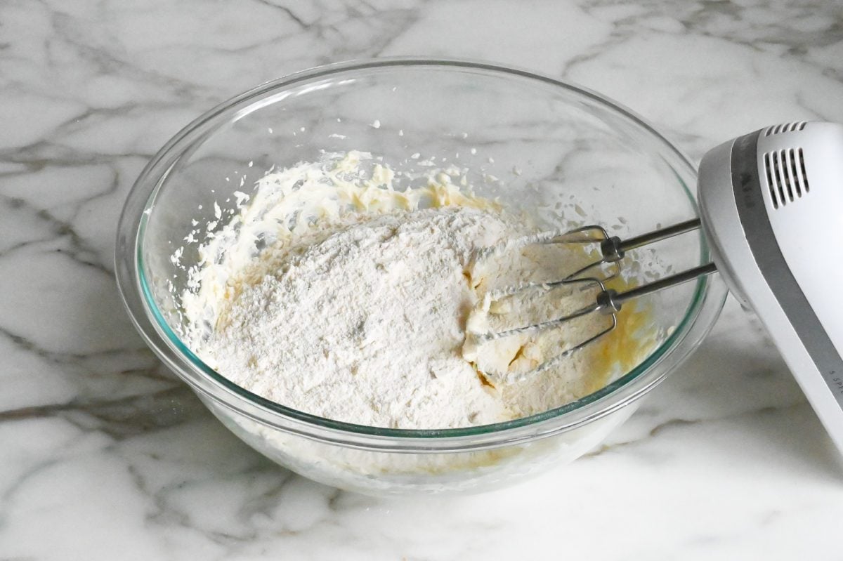 adding dry ingredients to butter mixture